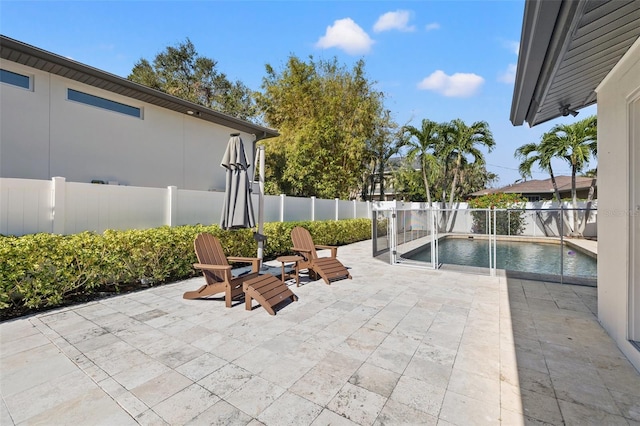 view of patio featuring a fenced in pool