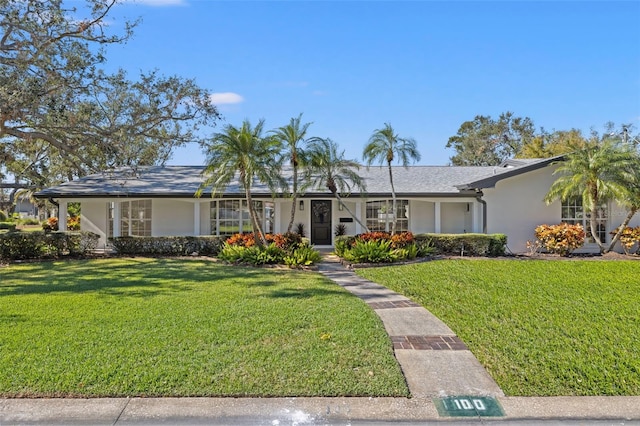 ranch-style home with a front yard