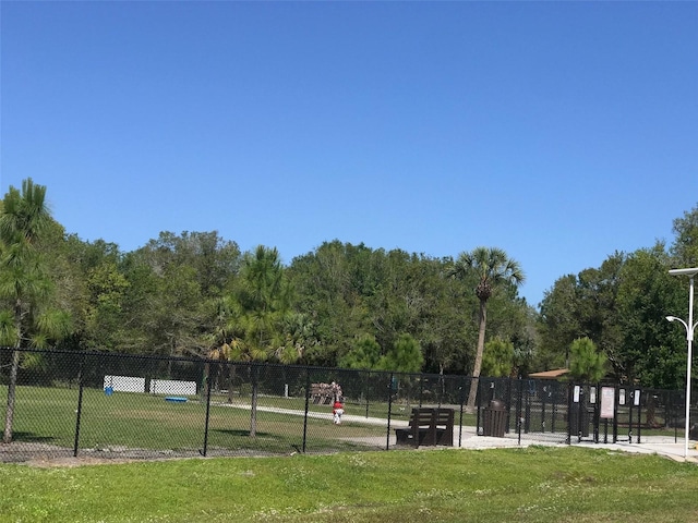 view of property's community featuring a yard