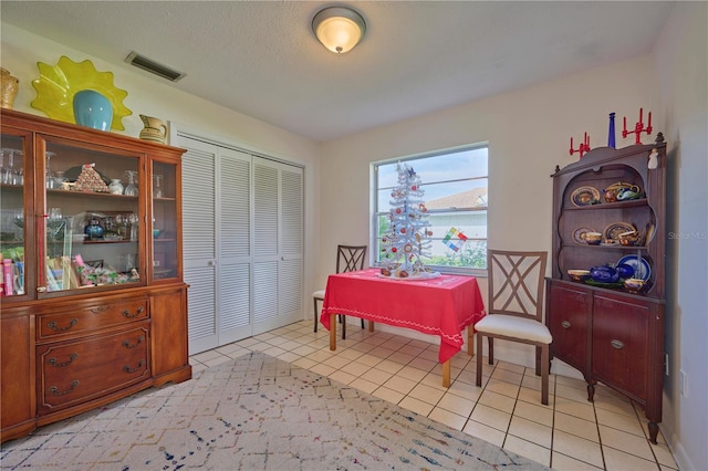 dining area featuring light tile patterned floors