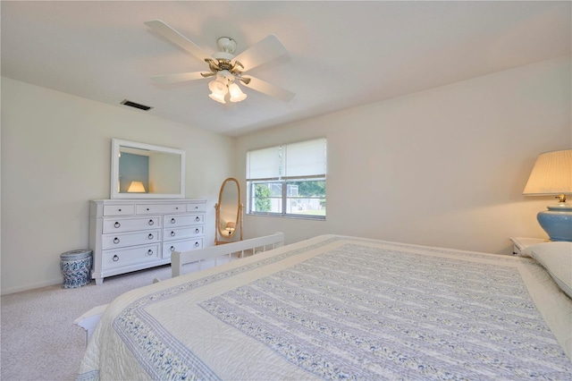 bedroom with ceiling fan and light colored carpet