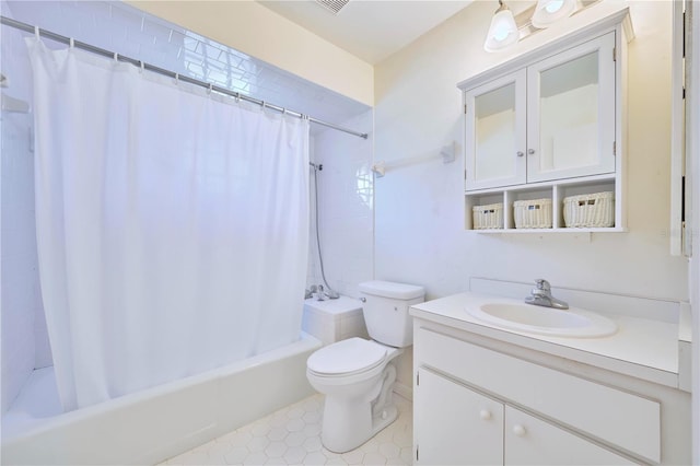 full bathroom featuring shower / tub combo, vanity, and toilet