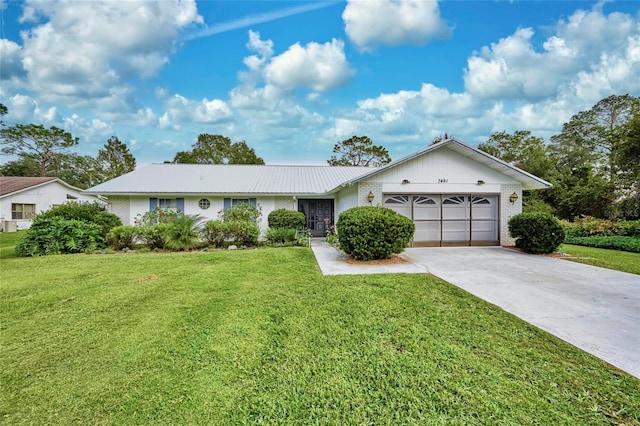 ranch-style house with a front lawn and a garage