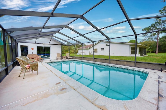 view of pool featuring a lawn, glass enclosure, an outdoor living space, and a patio