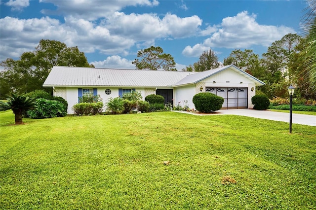 single story home featuring a front yard and a garage