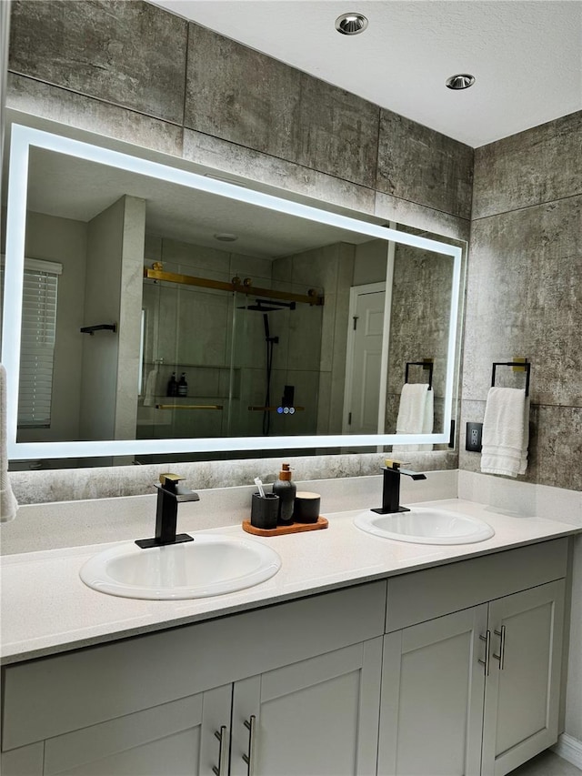 bathroom with vanity and walk in shower