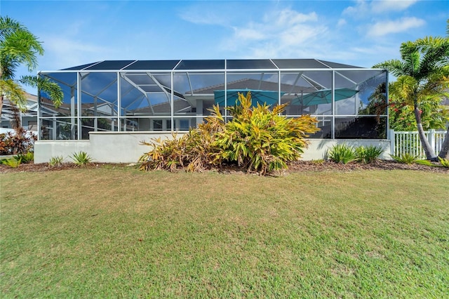 view of yard with glass enclosure