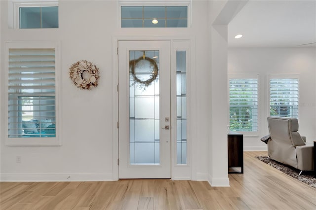 foyer entrance with light hardwood / wood-style floors