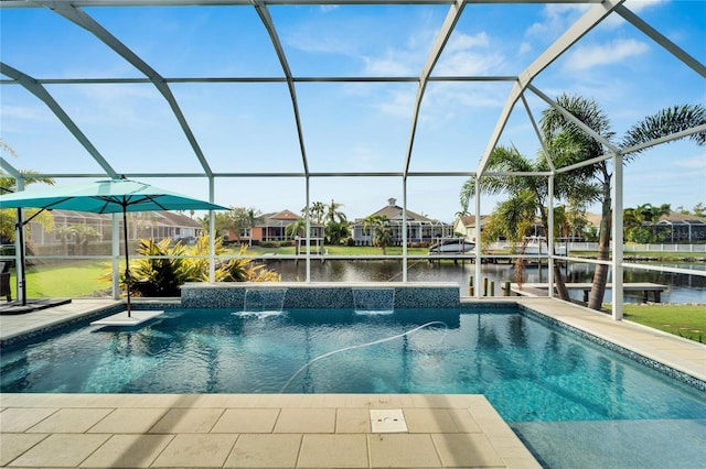 view of pool with a lanai, pool water feature, a patio area, and a water view