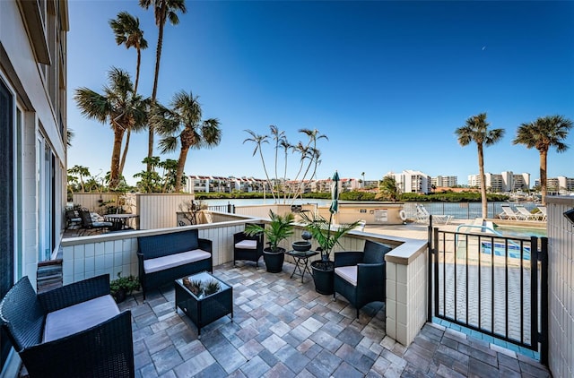 view of patio featuring a water view