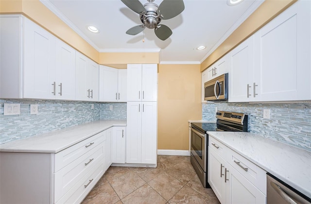 kitchen with crown molding, white cabinetry, backsplash, and appliances with stainless steel finishes