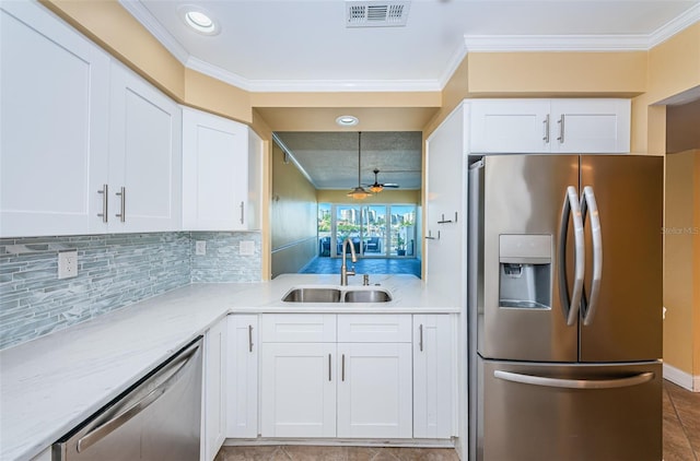 kitchen featuring white cabinets, sink, and appliances with stainless steel finishes