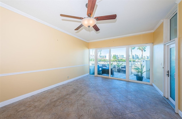 empty room with a view of city, baseboards, ornamental molding, and ceiling fan