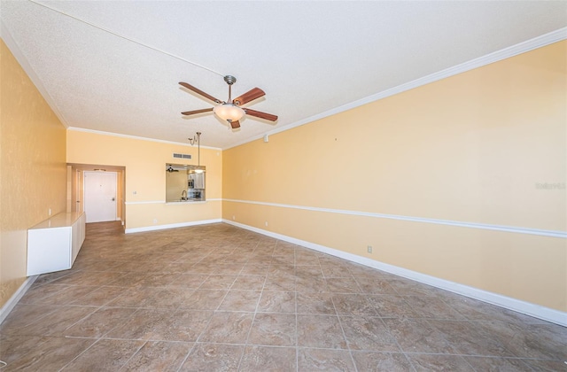 unfurnished room featuring crown molding, baseboards, ceiling fan, and visible vents
