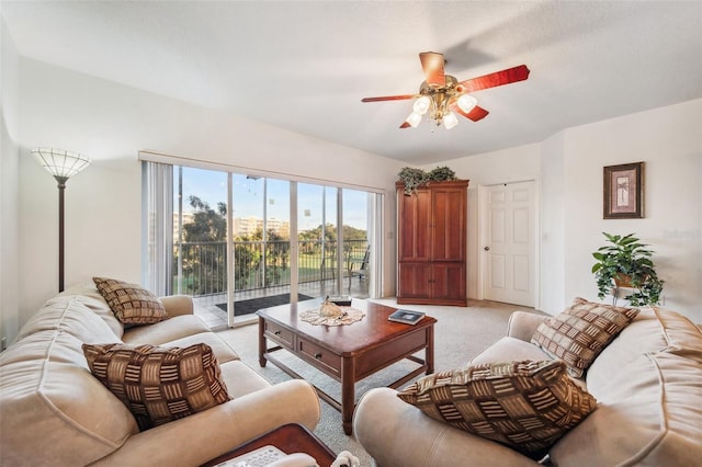 carpeted living room featuring ceiling fan