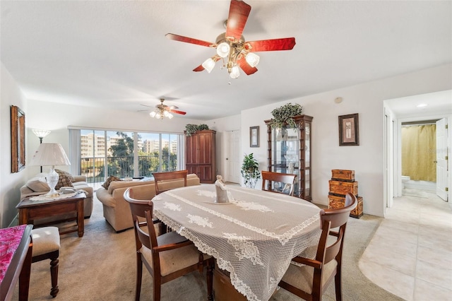 dining room with ceiling fan and light tile patterned floors