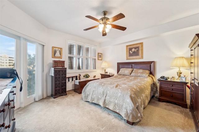 bedroom featuring ceiling fan and light colored carpet