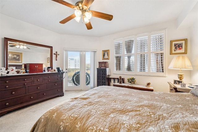 carpeted bedroom featuring access to exterior and ceiling fan