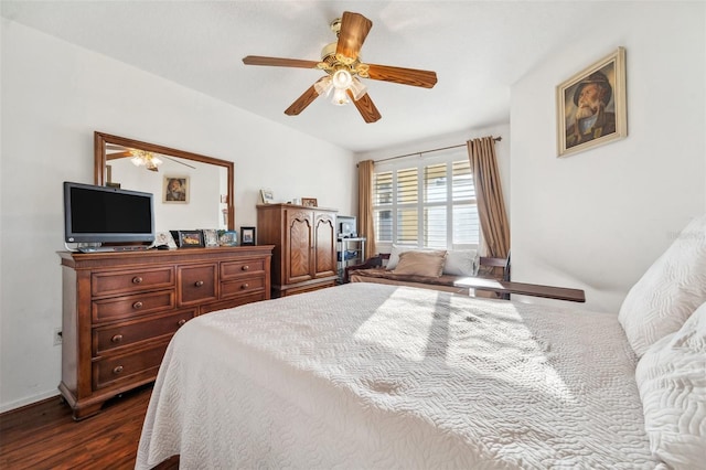 bedroom featuring ceiling fan and dark hardwood / wood-style floors