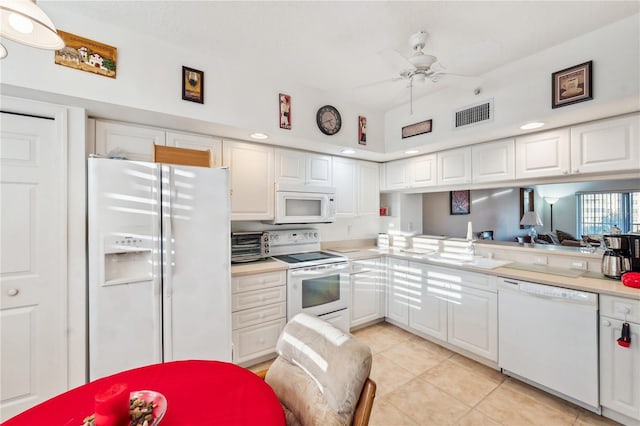 kitchen with white cabinets and white appliances