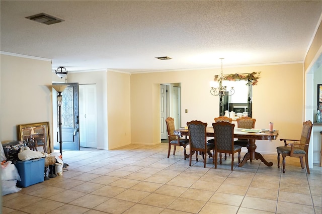 tiled dining space with crown molding, a textured ceiling, and an inviting chandelier