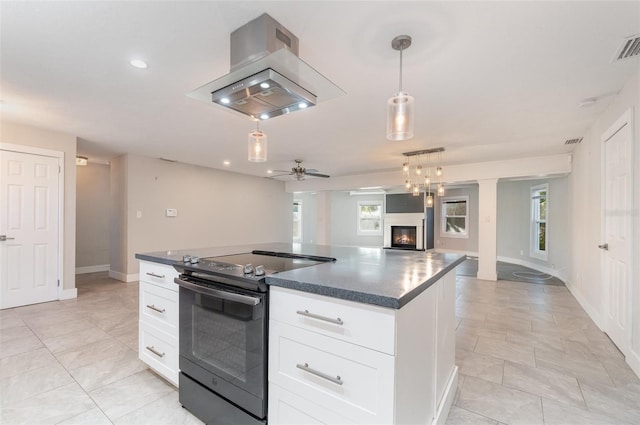 kitchen featuring white cabinetry, electric range, ceiling fan, hanging light fixtures, and island exhaust hood