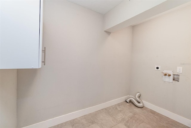 clothes washing area with hookup for an electric dryer, cabinets, and hookup for a washing machine