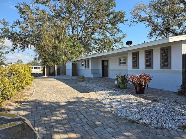 single story home featuring stucco siding