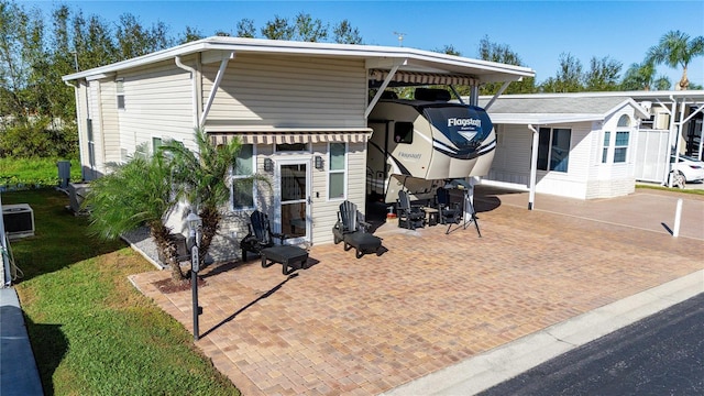 back of property with a patio area