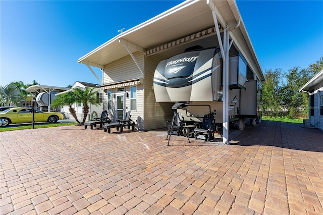 exterior space featuring a carport