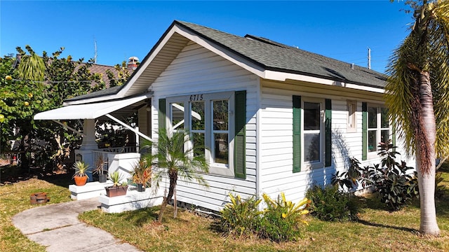 view of property exterior featuring a lawn