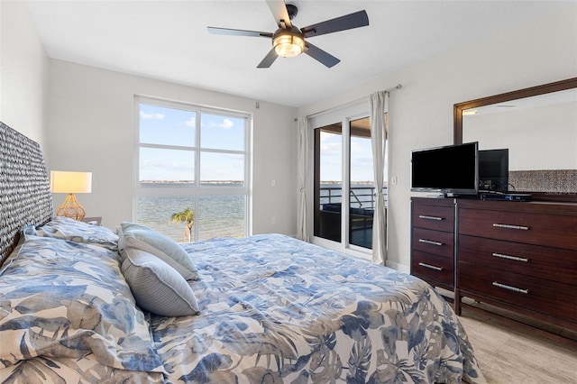 bedroom with light wood-type flooring, access to outside, and ceiling fan