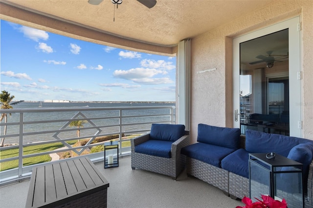 exterior space featuring a balcony and a water view