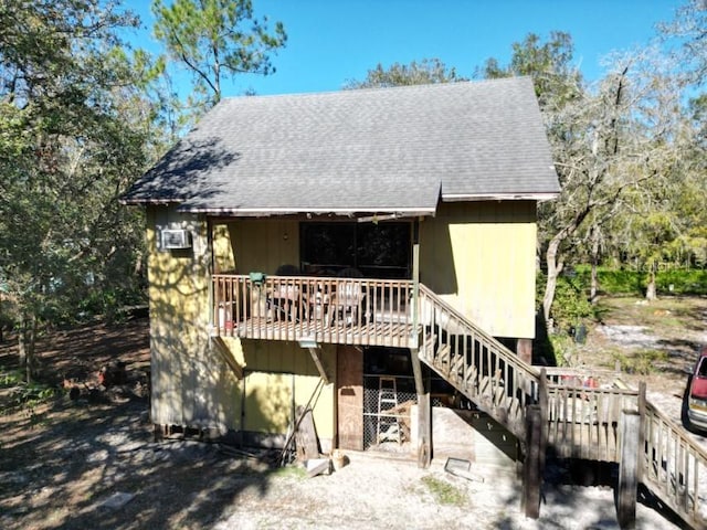 back of house with a wooden deck