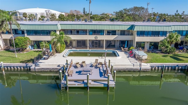 rear view of property featuring a water view