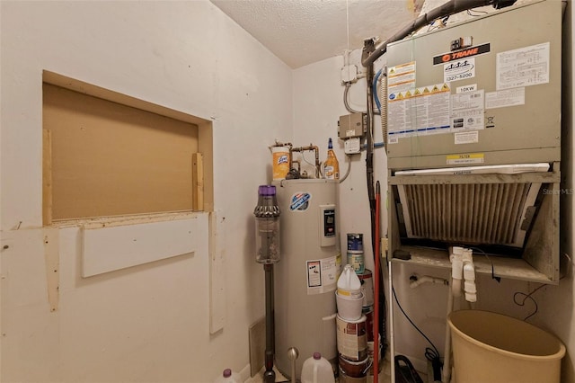 utility room with heating unit and water heater