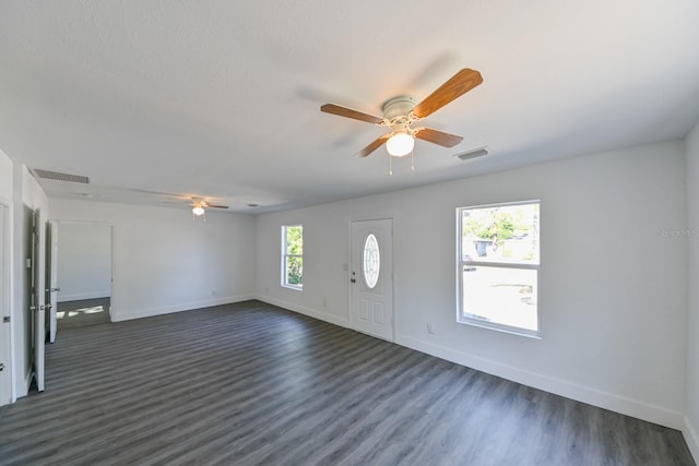 foyer featuring dark hardwood / wood-style flooring and ceiling fan