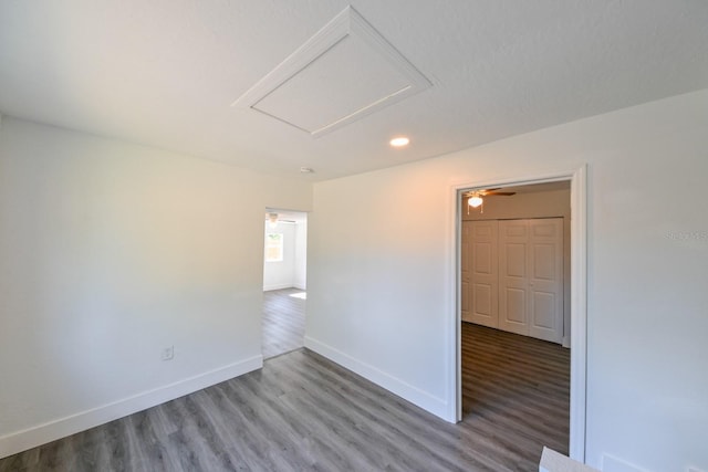 spare room featuring hardwood / wood-style flooring and ceiling fan