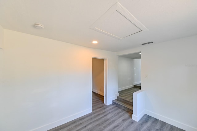 spare room with hardwood / wood-style flooring