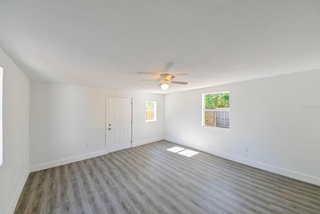 empty room featuring hardwood / wood-style flooring and ceiling fan