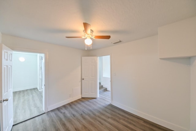 unfurnished room featuring hardwood / wood-style floors and ceiling fan