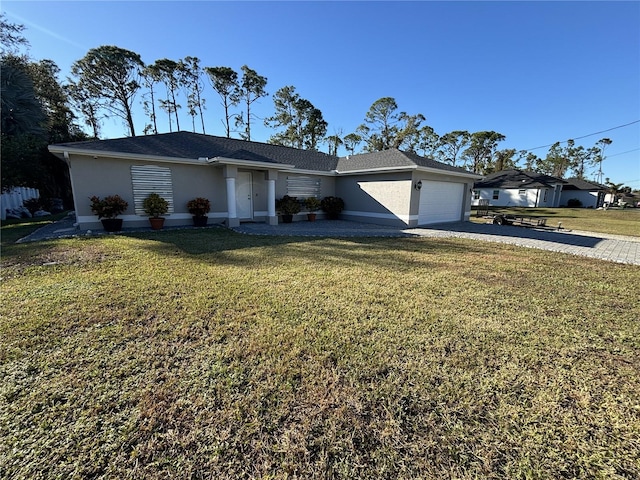 single story home with a front yard and a garage