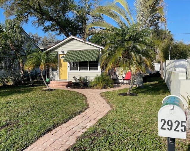 view of front of property with a front lawn