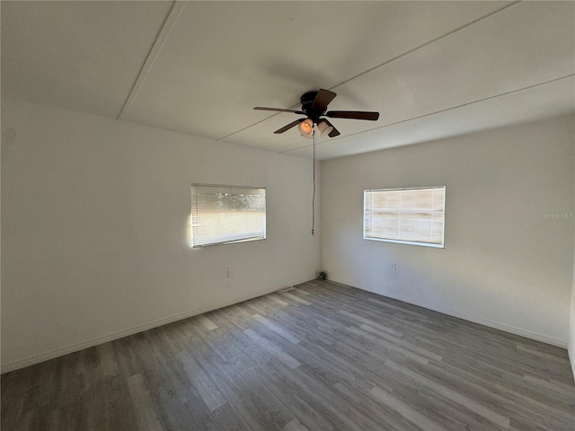 empty room featuring hardwood / wood-style floors and ceiling fan