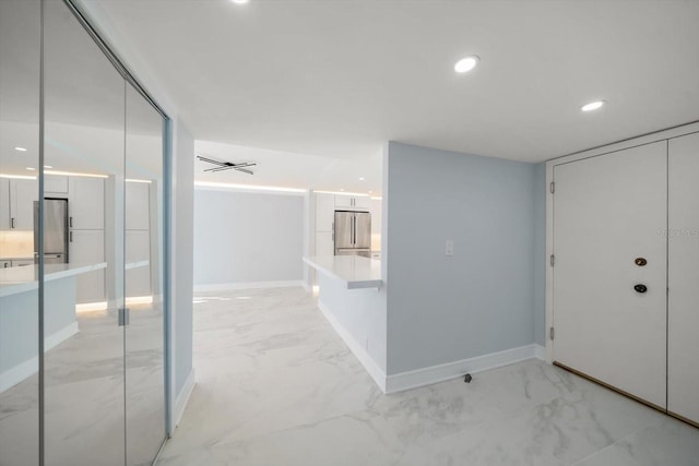 1400 Gulf Blvd Unit 801, Clearwater Beach, FL 33767 - hall featuring light marble finish floors, baseboards, and recessed lighting