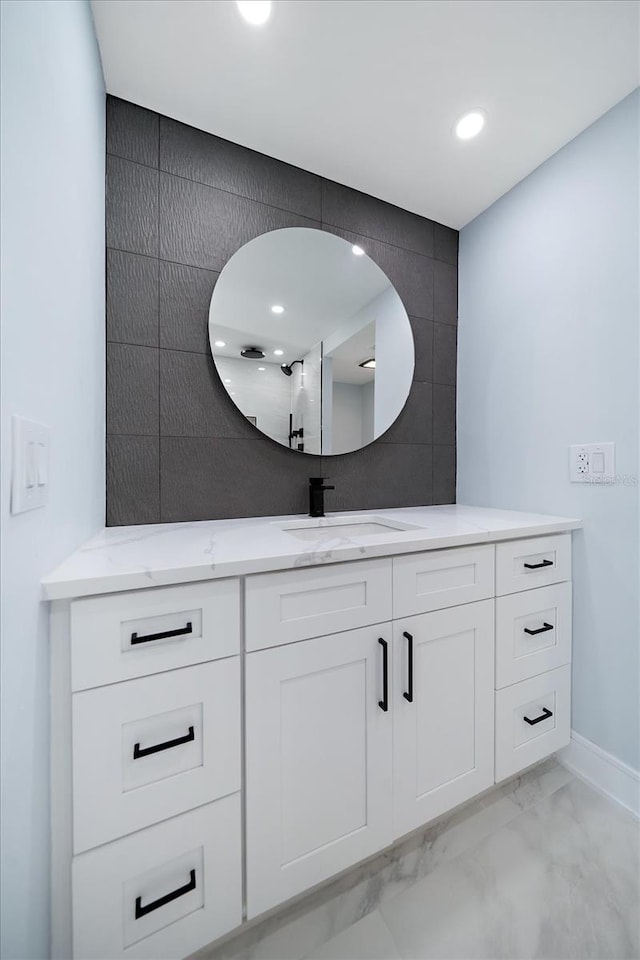 1400 Gulf Blvd Unit 801, Clearwater Beach, FL 33767 - bathroom with marble finish flooring, vanity, baseboards, and recessed lighting