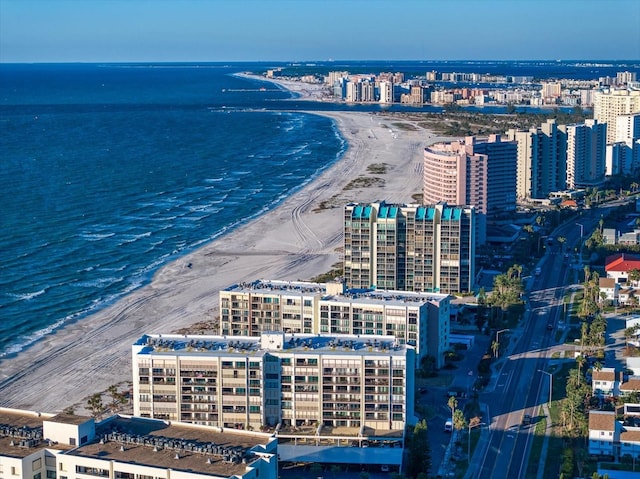 bird's eye view featuring a view of the beach and a water view