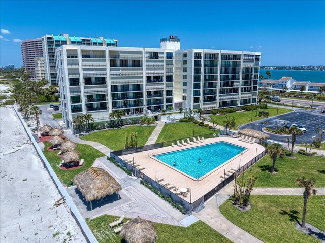 view of pool featuring a yard