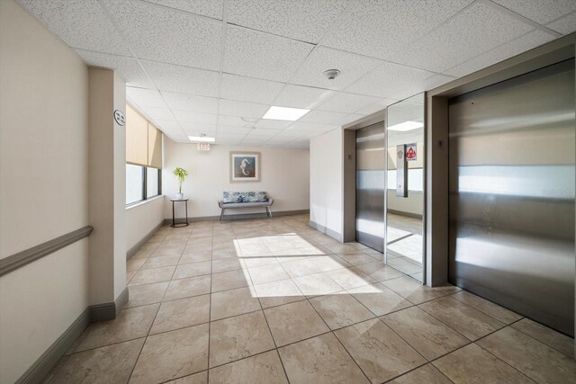 building lobby featuring a drop ceiling