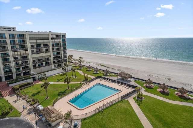 drone / aerial view of expansive coastline and a pool